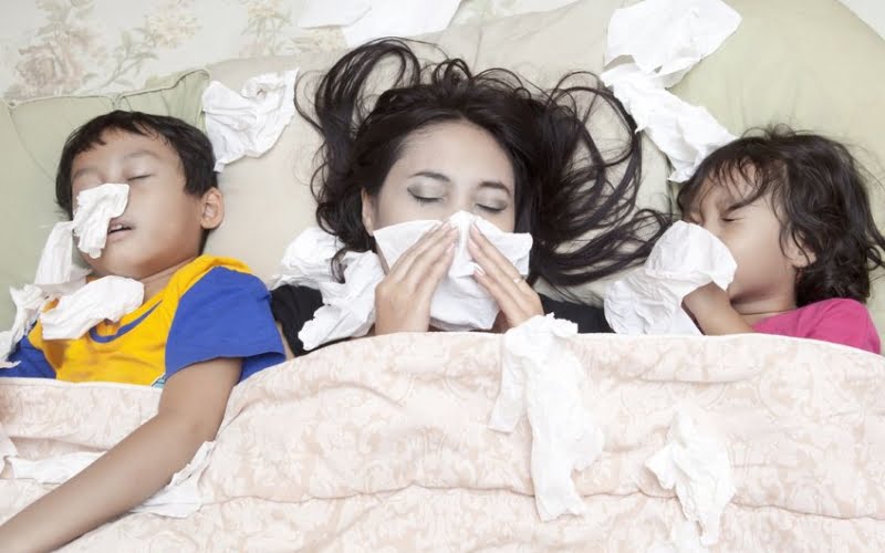 Grippekranke liegen im Bett